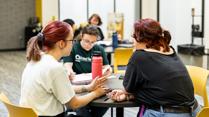 Three students standing