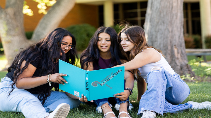 3 women looking at a CSI file