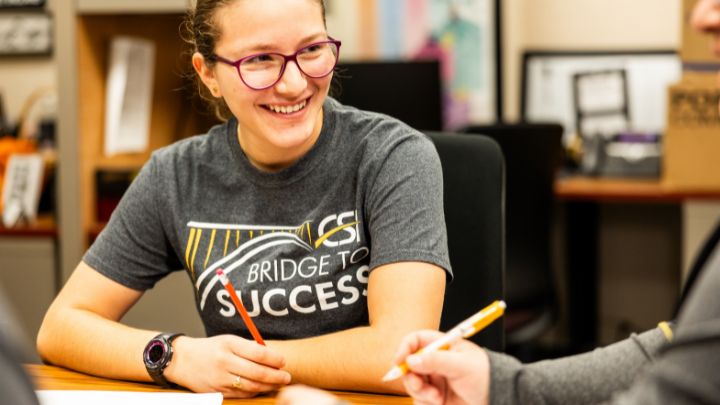 group of college freshmen posing in matching Bridge to Success shirts
