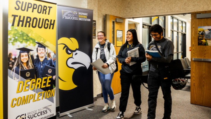 Three students standing
